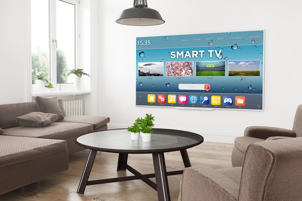 A smart TV mounted on the wall of a modern home