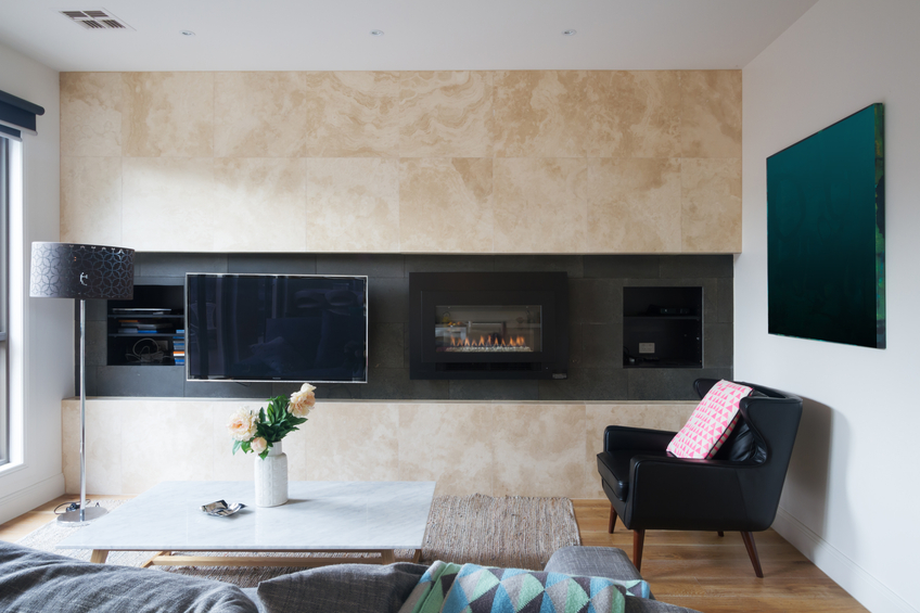 Living room with wall mounted tv and gas fireplace