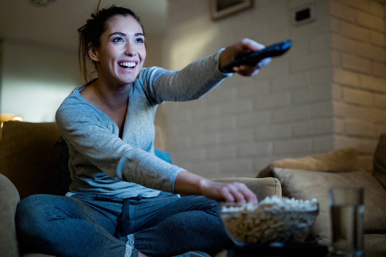 Woman Watching TV in darkened room