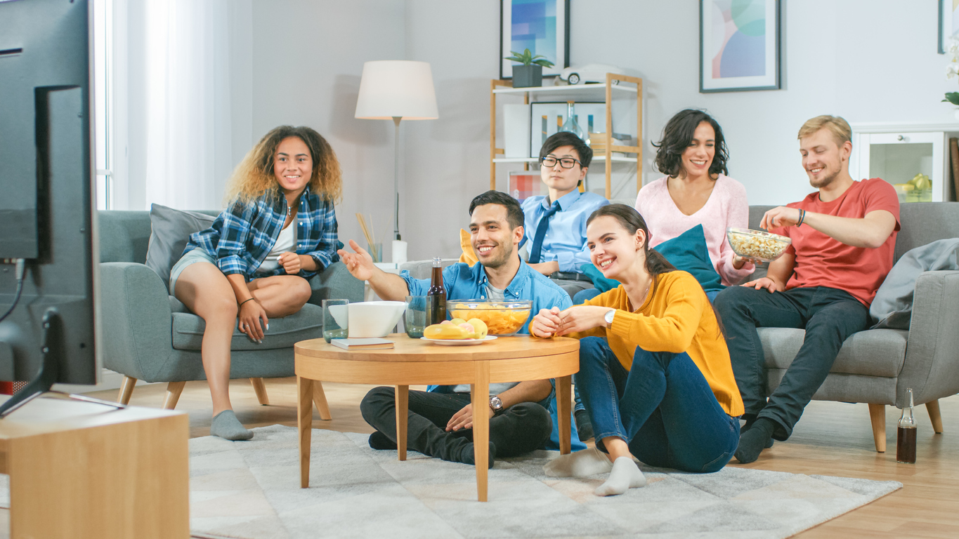 Group Friends Watching TV Together, Eating Snacks and Drinking